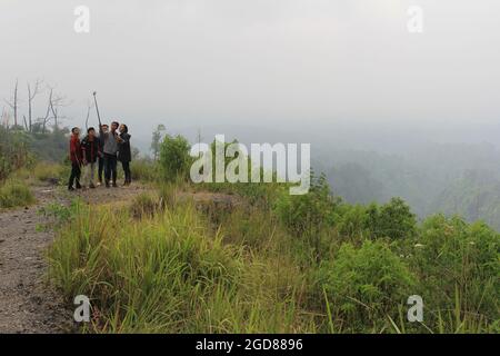 KEDIRI, INDONESIA - March 25, 2016: Tourists enjoying the scenery at the Mount Kelud tourist site Stock Photo