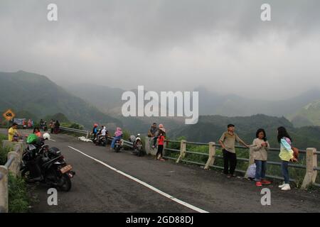 KEDIRI, INDONESIA - March 25, 2016: Tourists enjoying the scenery at the Mount Kelud tourist site Stock Photo