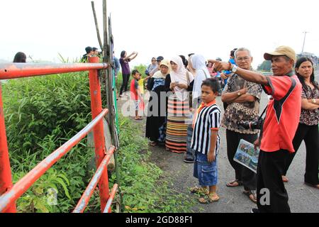 KEDIRI, INDONESIA - March 25, 2016: Tourists enjoying the scenery at the Mount Kelud tourist site Stock Photo