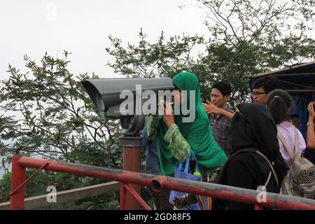 KEDIRI, INDONESIA - March 25, 2016: Tourists enjoying the scenery at the Mount Kelud tourist site Stock Photo