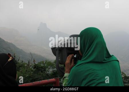 KEDIRI, INDONESIA - March 25, 2016: Tourists enjoying the scenery at the Mount Kelud tourist site Stock Photo