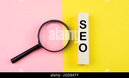 Search Engine Optimization ranking concept, abbreviation SEO on the wooden dice as an idea of promote traffic to website. Selective focus on wooden di Stock Photo