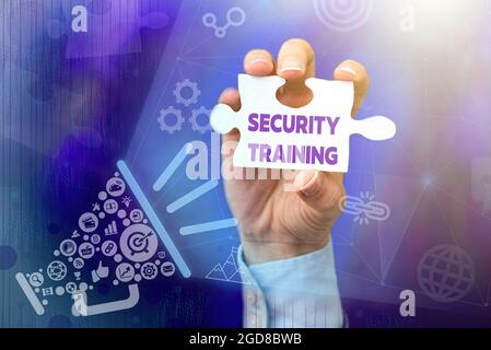 Handwriting text Security Training. Word for providing security awareness training for end users Hand Holding Jigsaw Puzzle Piece Unlocking New Stock Photo