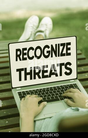 Handwriting text Recognize Threats. Word Written on potential to cause serious harm to a computer system Online Jobs And Working Remotely Connecting Stock Photo