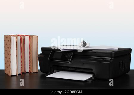 Compact home laser printer against gray background Stock Photo