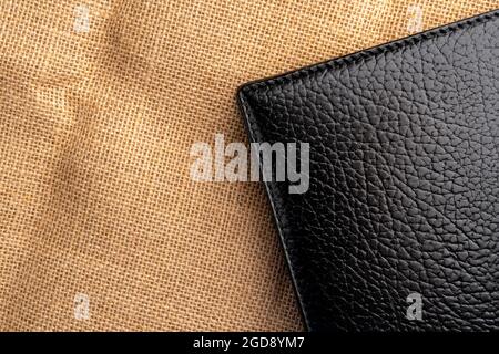 Black leather notebook on sackcloth. Copy space Stock Photo