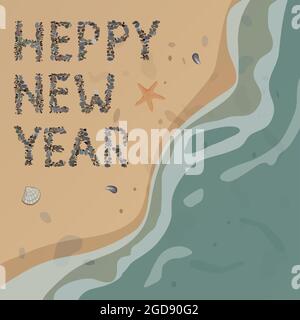 New Year's greetings are laid out with pebbles on the beach. Stock Photo