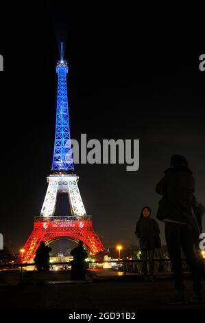 FRANCE, PARIS (75) 7TH ARRONDISSEMENT, EIFFEL TOWER ILLUMINATED IN BLUE WHITE RED IN MEMORY OF THE VICTIMS OF THE FRIDAY, NOVEMBER 13, 2015, FLUCTUAT Stock Photo