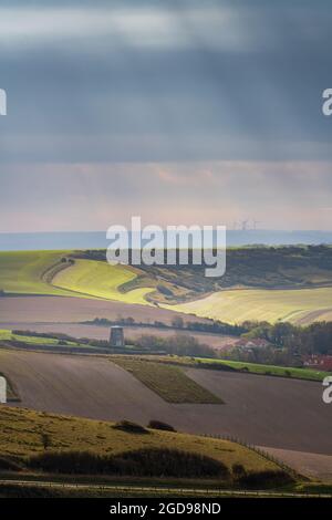 sun rays breaking through the clouds Stock Photo