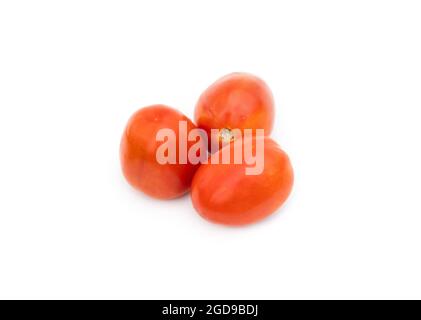 Three organic ripe tomatoes on an isolated white background Stock Photo