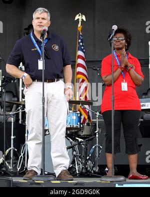 Brooklyn, NY, USA. 2 July, 2011. Commander, US Army Garrison - Fort Hamilton Colonel, Michael J. Gould, and, Command Sergeant Major US Army Garrison - Fort Hamilton CSM, Sylvia P. Laughlin, welcomes the audience at the Fort Hamilton Independence Day Weekend Celebration at Fort Hamilton. Credit: Steve Mack/Alamy Stock Photo