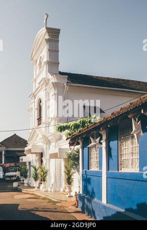 Old Portuguese christian church at picturesque street in Panjim, Old Goa, India Stock Photo