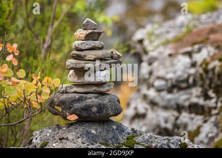 Balance stones on the rock in autumn forest Stock Photo