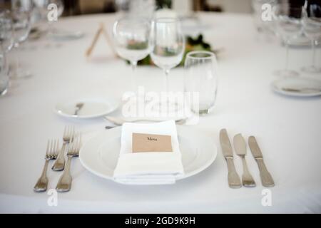 Table setting in a fancy restaurant before wedding reception Stock Photo