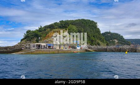 San Sebastian, Spain - 2 August 2021: Dock on Isla Santa Clara in the La Conca Bay Stock Photo