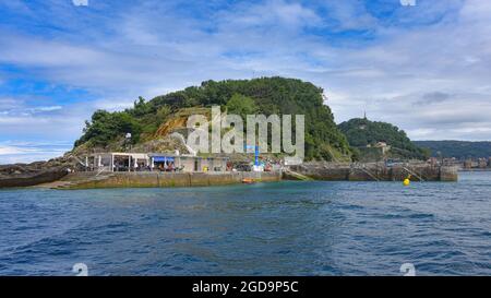 San Sebastian, Spain - 2 August 2021: Dock on Isla Santa Clara in the La Conca Bay Stock Photo