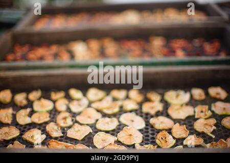 pieces of dried fruit on a pallets. Stock Photo