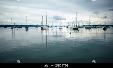 sailing yachts on calm lake, starnberger lake, germany Stock Photo