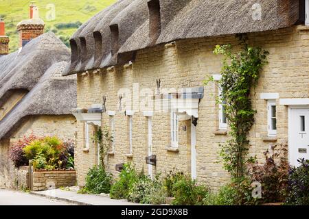 Traditional England thatched cottages, in West Lulworth, Dorset, southwest England, Great Britain. Stock Photo