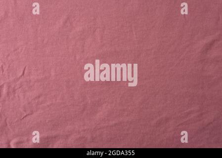 texture of peach color fabric, close-up, wallpaper. Stock Photo