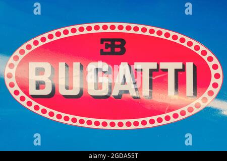 Drempt, The Netherlands - July 9, 2021: Ancient Bugatti logo on a blue classic racing car in Drempt, The Netherlands Stock Photo