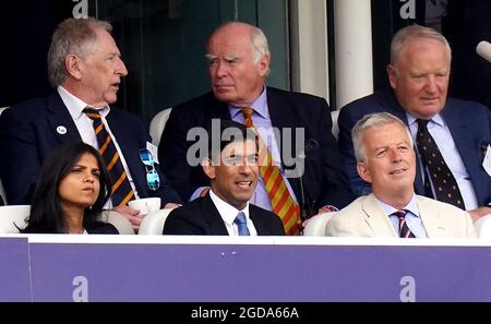 Chancellor of the Exchequer Rishi Sunak (front centre) alongside his wife Akshata Murthy in the stands during day one of the cinch Second Test match at Lord's, London. Picture date: Thursday August 12, 2021. Stock Photo