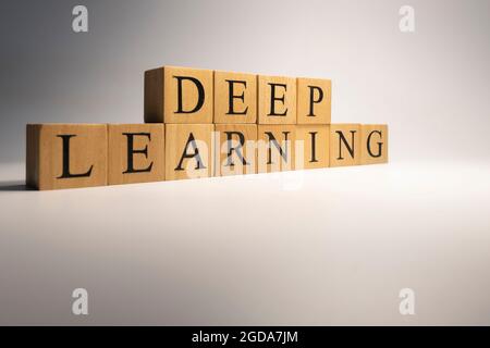 Deep learning chain was created from wooden cubes. Industry and technology. close up. Stock Photo