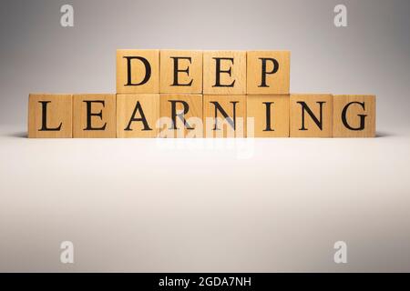 Deep learning chain was created from wooden cubes. Industry and technology. close up. Stock Photo