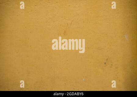 Yellow texture on the wall of a house. Pelourinho, Salvador, Bahia, Brazil. Stock Photo