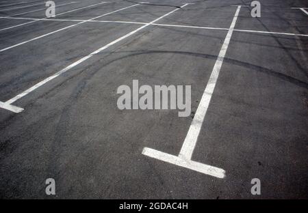 Parking kiosks in the parking lot, marked with white lines. Empty parking lot. Outdoor car park with freshly painted kiosk lines. Outdoor parking on a Stock Photo