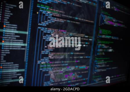Code on screen blurry background image Stock Photo