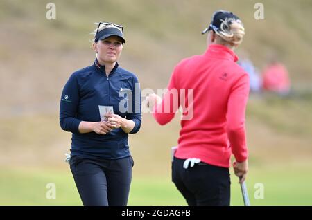 Denmark's Nanna Koerstz Madsen (left) and Sweden's Madelene Sagstrom on the 18th green during day one of the Trust Golf Women's Scottish Open at Dumbarnie Links, St Andrews. Picture date: Wednesday August 11, 2021. Stock Photo