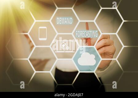 Hand writing sign Demand Forecasting. Business approach predict customer demand to optimize supply decisions Lady In Uniform Standing Holding Tablet Stock Photo