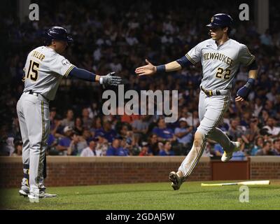 Chicago, USA. 11th Aug, 2021. The Milwaukee Brewers' Christian Yelich (22) is congratulated by teammate Tyrone Taylor (15) after Yelich scored on a sacrifice fly by Omar Narvaez in the fourth inning against the Chicago Cubs at Wrigley Field in Chicago on Wednesday, Aug. 11, 2021. (Chris Sweda/Chicago Tribune/TNS/Sipa USA) Credit: Sipa USA/Alamy Live News Stock Photo