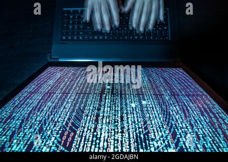 Bird's eye view of binary code on notebook monitor Stock Photo