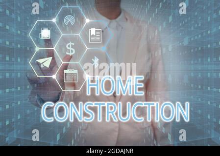 Text showing inspiration Home Construction. Conceptual photo the process of constructing a living accommodation Lady In Uniform Holding Tablet In Hand Stock Photo
