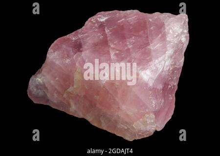 unpolished rose quartz specimen isolated on a black background Stock Photo