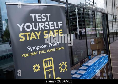 Free NHS test and trace lateral flow testing kits being given out in the city centre on 3rd August 2021 in Birmingham, United Kingdom. Rapid lateral flow self testing kits are for people who do not have symptoms of coronavirus / COVID-19 and give a quick result. Stock Photo