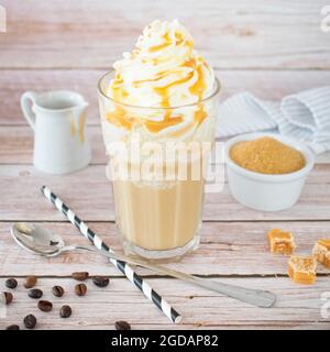 Frappuccino with whipped cream and caramel sauce. Stock Photo