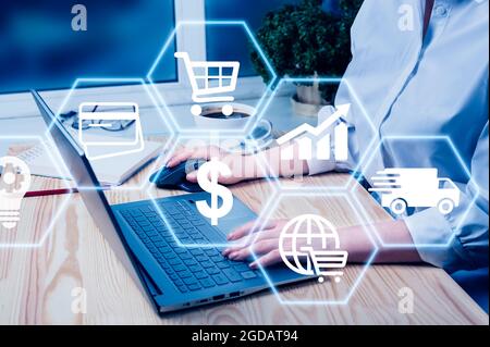 Hand using laptop with global reports and stock market change concept. E-commerce concept. E-commerce and online shopping concept. Global Business, Fi Stock Photo