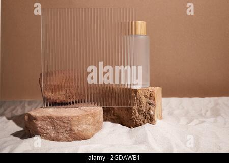 Podium stand and textured glass on sand background. Display for cosmetic perfume fashion natural product Stock Photo