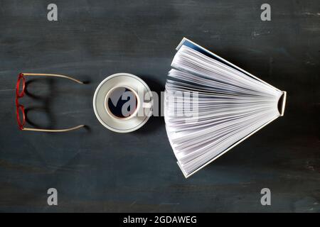 Open book, cup of coffee and eyeglasses,flat lay on, reading, education, literature, learning Stock Photo