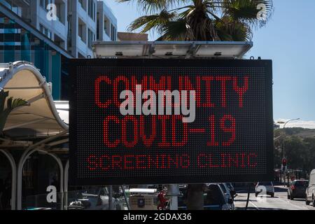 Sydney, Australia. Thursday 12th August 2021. COVID-19 screening clinic signage along Campbell Parade, Bondi Beach. Lockdown restrictions for parts of greater Sydney have been further extended due to the Delta Variant spreading. Credit: Paul Lovelace/Alamy Live News Stock Photo