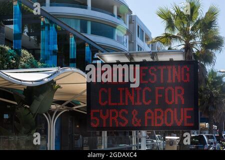 Sydney, Australia. Thursday 12th August 2021. COVID-19 screening clinic signage along Campbell Parade, Bondi Beach. Lockdown restrictions for parts of greater Sydney have been further extended due to the Delta Variant spreading. Credit: Paul Lovelace/Alamy Live News Stock Photo