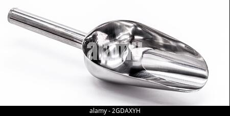 metal measuring spoon on isolated white background. Stock Photo