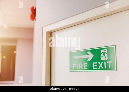 Emergency Fire exit door with alarm bell in condominium and commercial building. Stock Photo