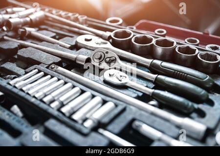 Above view of used greasy old dirty car repair mechanic hand tool set kit vehicle repair and maintencae service. Hardware toolkit with many different Stock Photo