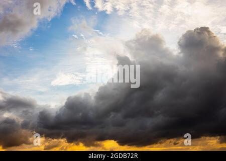 large darkness cloud in the sky with difference sky color from light refraction. Stock Photo