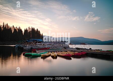 SANTA CLARA, UNITED STATES - Jul 31, 2021: The colorful kayak boats in the calm water, Santa Clara at dawn Stock Photo