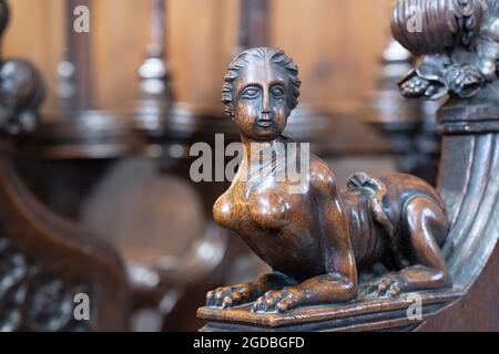 Medieval 16th century carvings on the ends of the stalls in the quire, Beverley Minster interior, Beverley Yorkshire UK Stock Photo